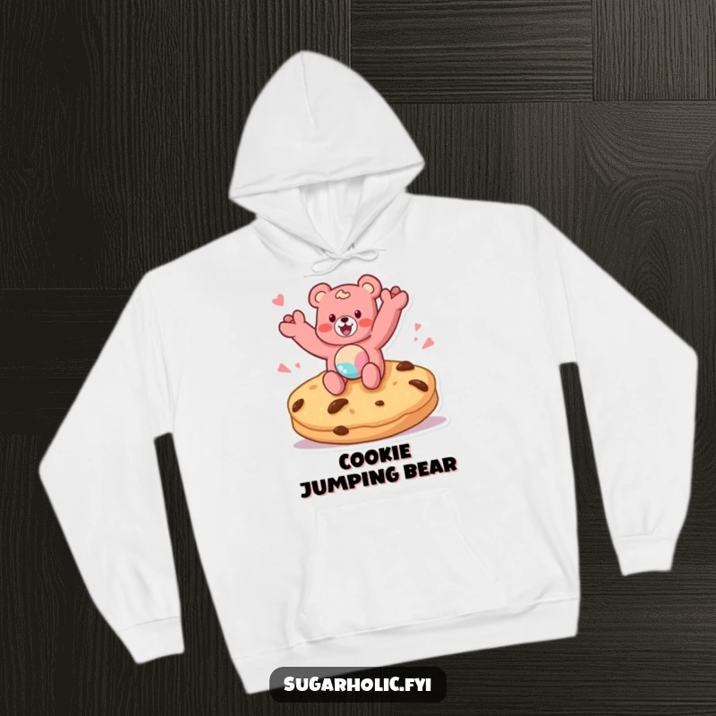 Funny hoodie depicting a gummy bear character joyfully jumping on a giant cookie, offering warmth and a taste of sweet humor.