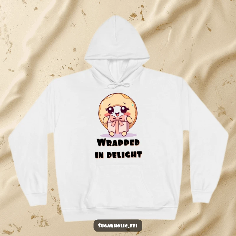 Funny donut character with wide, excited eyes unwrapping a present, depicted on a warm and humorous hoodie.