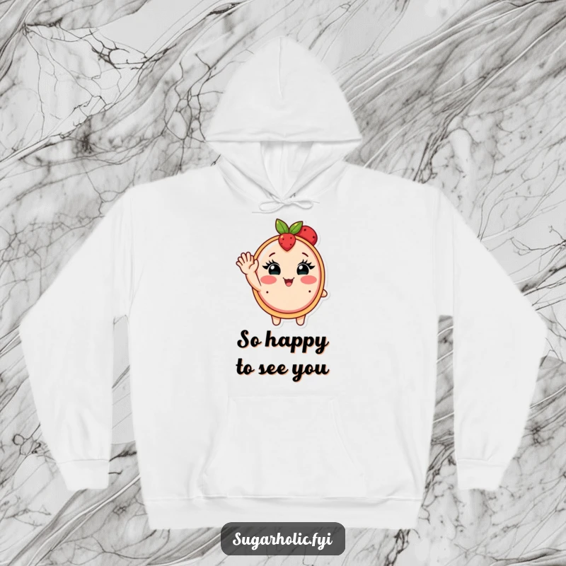 Funny hoodie featuring a blushing fruit tart with eyelashes waving enthusiastically, offering warmth and charm.