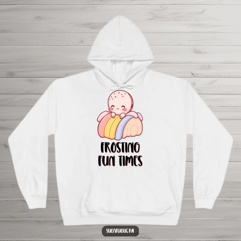 Funny macaroon character blushing and sliding down a frosting rainbow, hooded sweatshirt, cozy and charming humorous apparel.