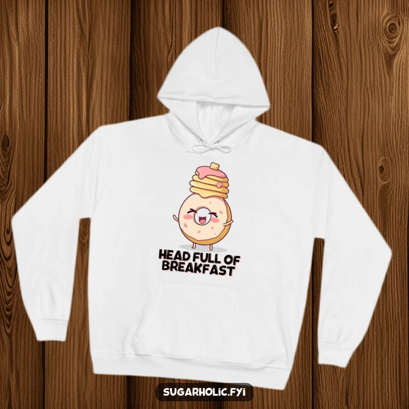 Funny hoodie design of a happy, round donut character winking with gusto while balancing a generous stack of pancakes.
