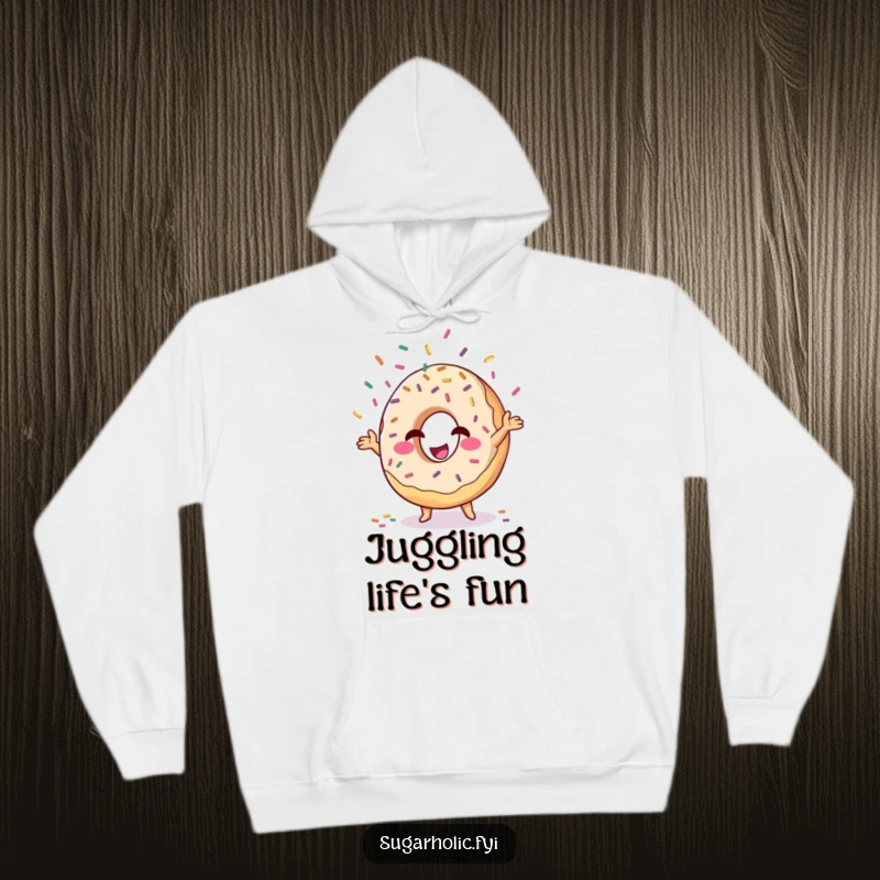 Funny donut character winking and juggling sprinkles, hooded sweatshirt, cozy and witty humorous apparel.