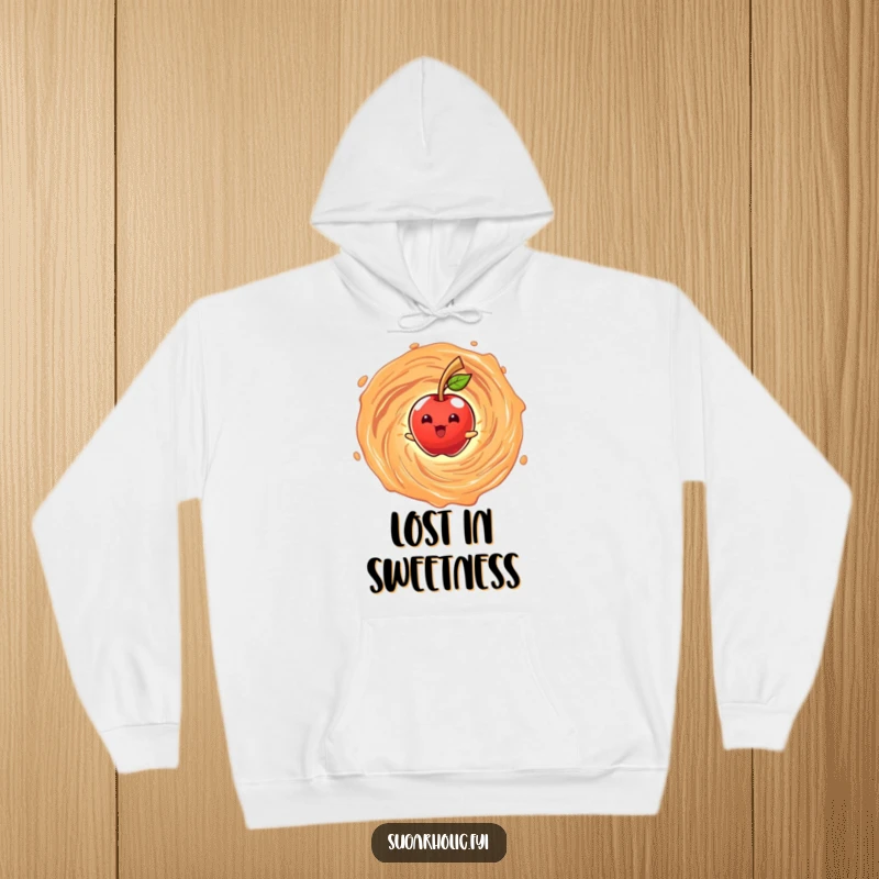 Funny hoodie featuring a beaming anthropomorphic candy apple character spinning in a caramel vortex for cozy and sweet humorous wear.