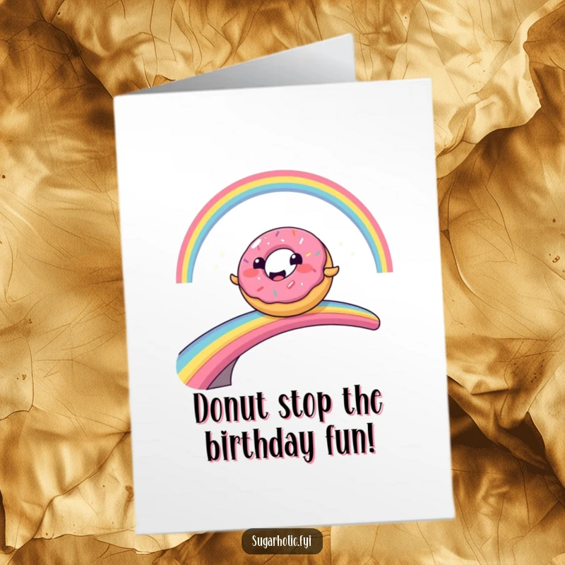 Funny free printable birthday card featuring a smiling donut character comically sliding across a vibrant rainbow bridge.