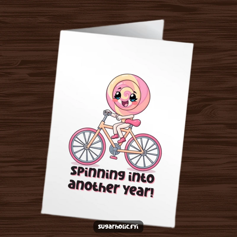 Funny Free Printable Birthday Card: A lollipop character excitedly pedals a tiny rock candy bicycle, spreading birthday cheer.